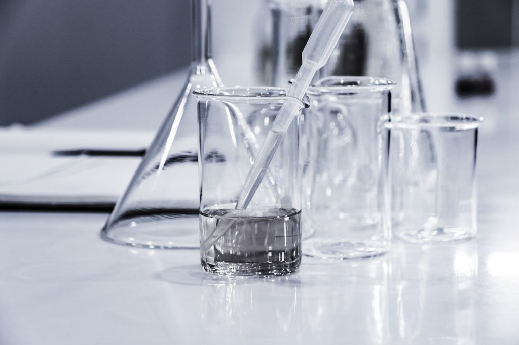 Laboratory glassware representing fuel sampling and quality testing